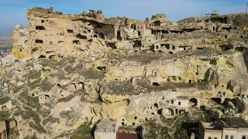 Aerial drone view the old troglodyte settlement of Cavusin, in Cappadocia, Turkey. This location is part of the Goreme National Park and the Rock Sites of Cappadocia inscribed as a Unesco site. video