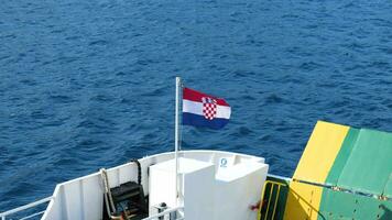 Croatian flag on the ferry. Travel to Croatia. Boat as a means of transportation. video