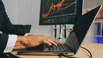 Financial Analyst Working on a Computer with Multi-Monitor Workstation with Real-Time Stocks, Commodities and Foreign Exchange Charts. Businessman Works in Investment Bank City Office at Night. video