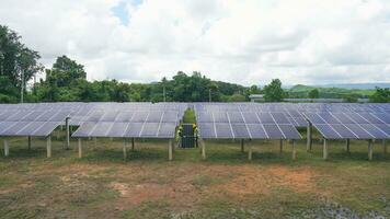 Two asian engineers installing solar panels . Solar energy clean and green alternative energy. Unity and teamwork. photo