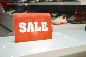 Close up of sale sign in a shoe store. photo