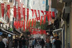 turkey istanbul 12 june 2023. Turkish Flags at popular galata tower street photo