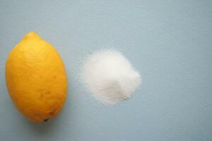 salt and lemon on blue background photo