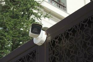 CCTV security camera operating outdoor photo