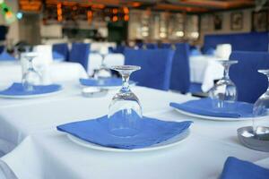 served and decorated round festive table in a restaurant photo