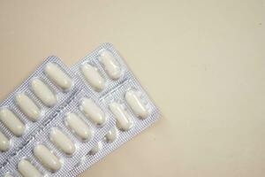 Close up of pills of blister pack on table photo