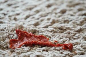 Tomato stain on a carpet indoors, photo