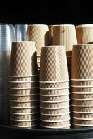 stacks of stacked clean craft cups for hot drinks photo