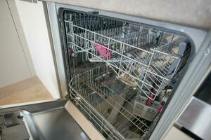 Inside of the empty dishwasher. photo