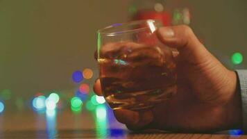 Close up of two people are cheering with cocktails in a bar or disco club. video