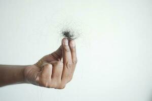 man hold his list hair close up photo