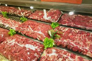 raw red meat display for sale at shop photo