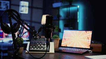 Close up shot of microphone used for podcasts, vlogging and livestreams on vlog channel. Zoom in on professional mic in dimly lit studio used for recording audio during internet show video