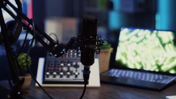 Close up shot of professional microphone used to produce quality internet show for online livestreaming channel. Streaming sound capturing and recording podcasting tool in empty living room video