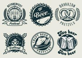 Set of emblems with beer barrel, hop and mug vector