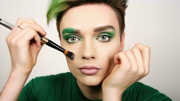 ai generado de cerca retrato de un Transgénero hombre aplicando constituir. joven gay hombre aplicando maquillaje en su rostro, tomando cuidado de su apariencia, vistiendo verde suéter aislado en blanco antecedentes foto