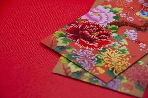 Close up of colorful envelope on red cover background with customizable space for text photo