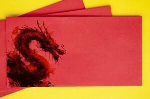 Top view of Red dark Dragons on Chinese New Year red packet photo