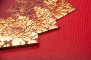 Red envelope on red background with customizable space for text. Chinese New Year celebration photo