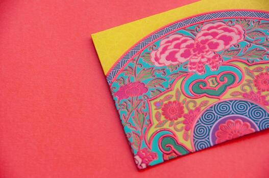 Close up of colorful envelope on red cover background with customizable space for text photo