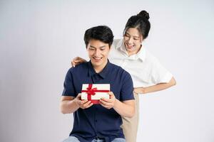 Image of an Asian couple posing on a white background photo