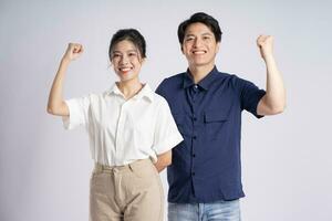 Image of an Asian couple posing on a white background photo