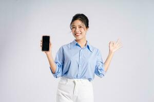 Portrait of young Asian businesswoman, isolated on white background photo