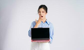 Portrait of young Asian businesswoman, isolated on white background photo