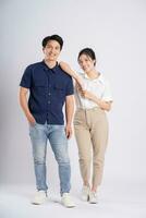 Image of an Asian couple posing on a white background photo