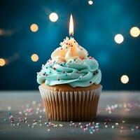 AI generated StockImage Birthday cupcake with a burning candle on blue background, closeup For Social Media Post Size photo