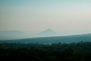 a travel Mountain view and thin fog photo