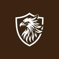 Eagle head shield vector logo design template. Eagle head shield vector logo design.