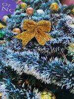 Christmas tree decorations with gold ribbon photo