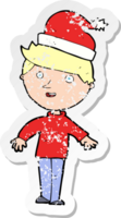 retro distressed sticker of a cartoon boy in santa hat png