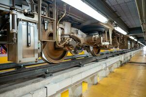 Wheels and suspension of electric train parked in a depot photo