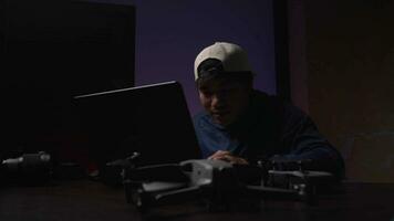 Asian creator editing production work in neon-lit office. video