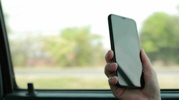 Person using phone on car, using smartphone in car video