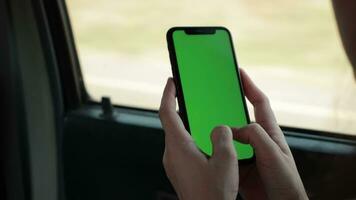 Person using phone on car, using smartphone in car video