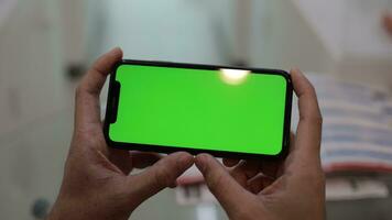 Using phone, phone green screen in hand video