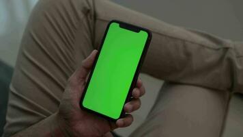 Using phone, phone green screen in hand video