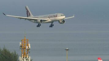 Airbus A330 Qatar Airways landing, sea background video