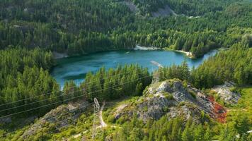 Aerial view on lake hidden somewhere in mountains near Whistler video