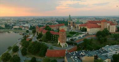 Historic royal Wawel Castle in Krakow at sunset, Poland. Orbit shot video