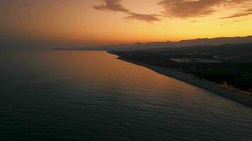 Sunset sky And silhouette of Calabrian coast near the sea video