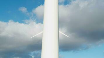 Clouds behind a wind turbine as a renewable energy concept video