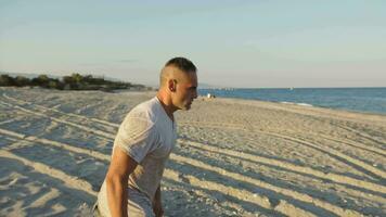 Man with camouflage dives into the sea video