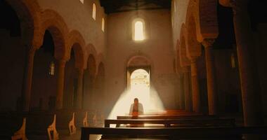 Man praying in the Church video