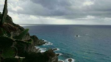 windy and stormy day at the sea near the cliff video