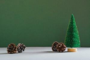 Christmas decorative spruce and pine cones on a green background photo