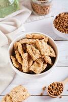 Alternative protein dry soy meat in a bowl on the table vertical view photo